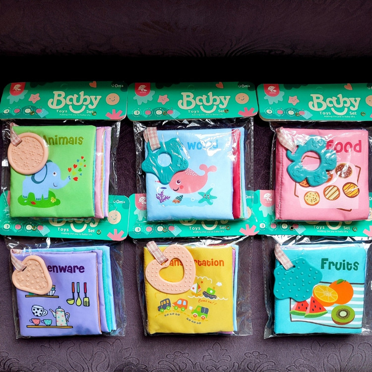 کتاب پارچهای وارداتی نوزاد به همراه دندانگیر و سوت